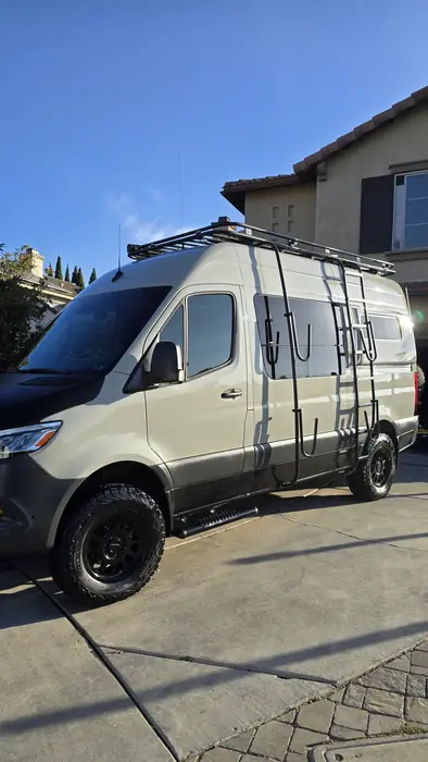 Sand-coloured Sprinter 4x4 camper van after a full exterior detail